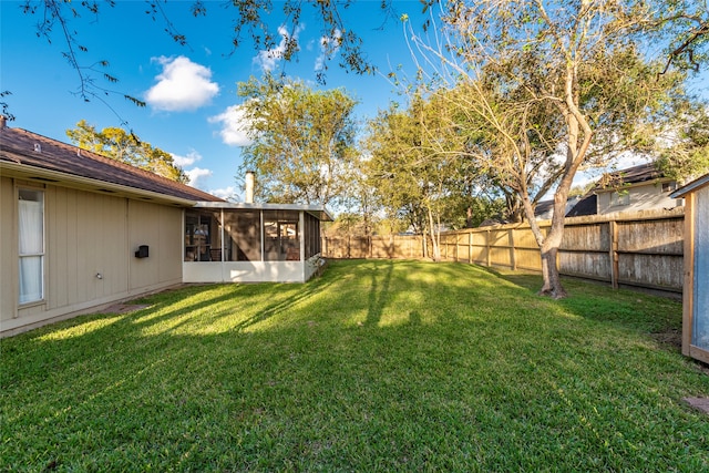 view of yard with a sunroom