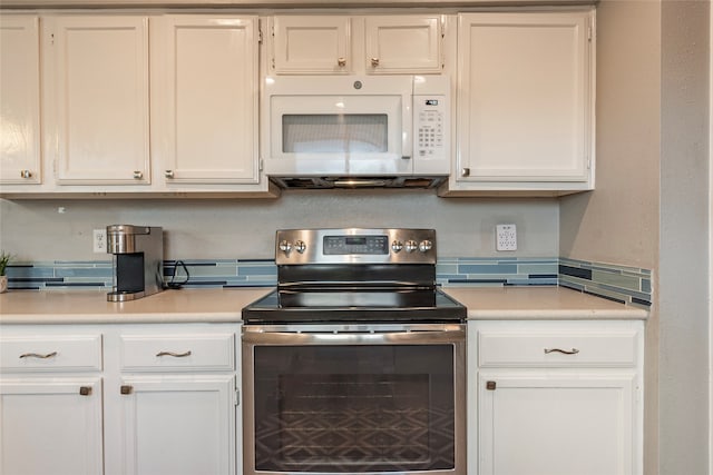 kitchen featuring stainless steel electric stove and white cabinets