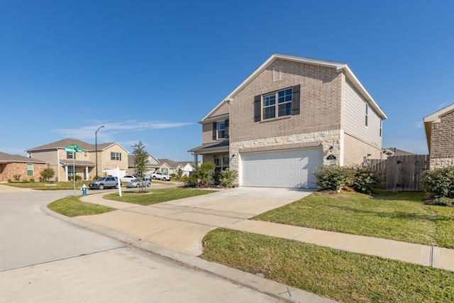 view of front of house featuring a front lawn and a garage