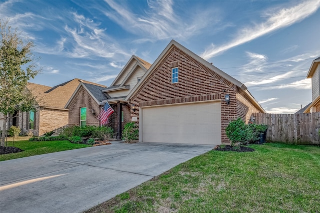 front of property featuring a garage and a front lawn