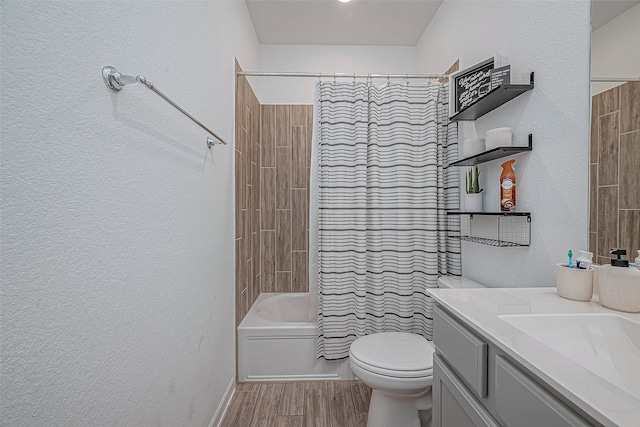 full bathroom featuring hardwood / wood-style floors, vanity, toilet, and shower / bathtub combination with curtain