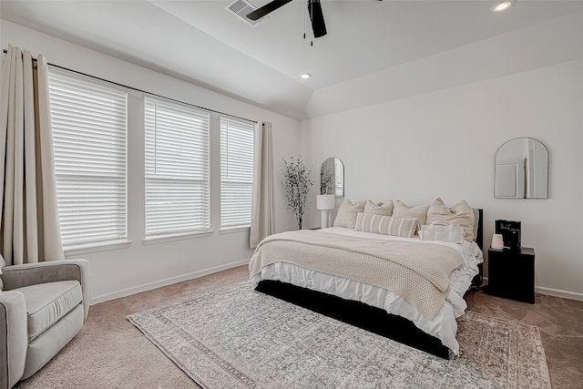 bedroom with ceiling fan, light carpet, and vaulted ceiling