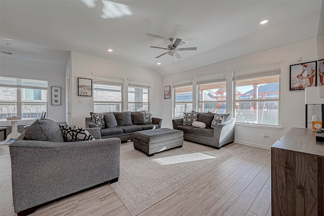 living room with ceiling fan and light hardwood / wood-style floors