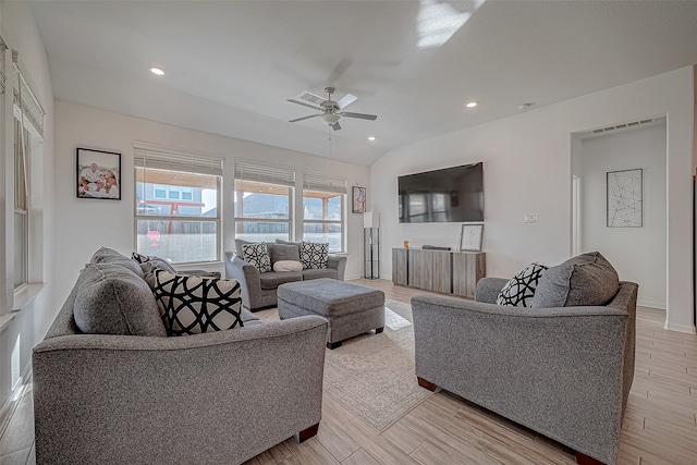 living room with light hardwood / wood-style floors and ceiling fan