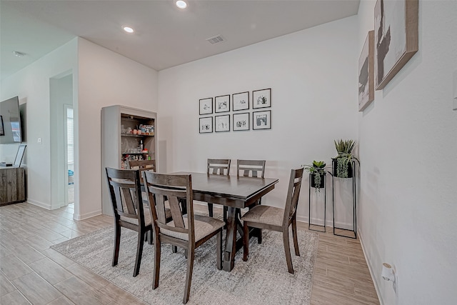 dining space featuring light wood-type flooring