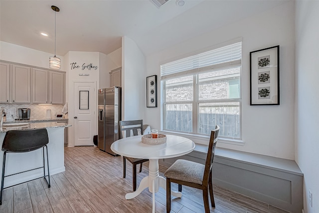 dining area featuring light hardwood / wood-style flooring and sink