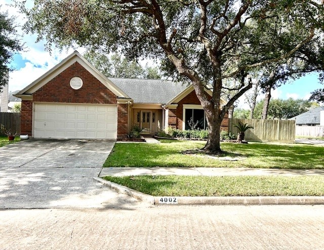 view of front facade featuring a garage and a front yard