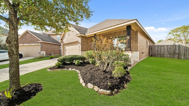 view of front of house with a garage and a front lawn