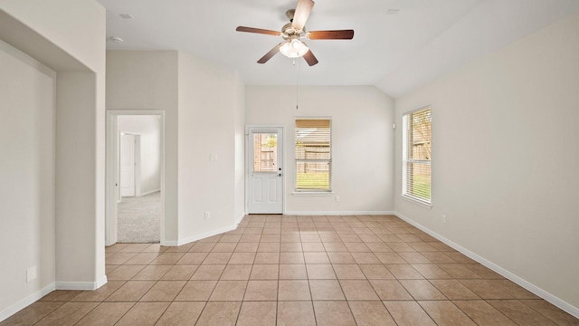 tiled spare room with ceiling fan and lofted ceiling