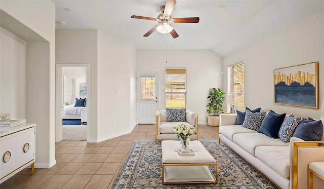 tiled living room featuring ceiling fan and vaulted ceiling