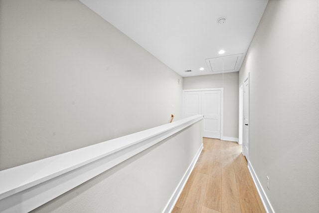 hallway with light hardwood / wood-style flooring