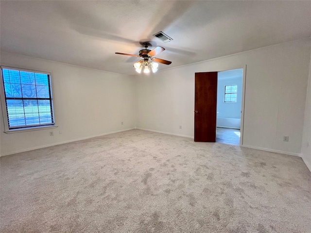 unfurnished room featuring ceiling fan and light colored carpet