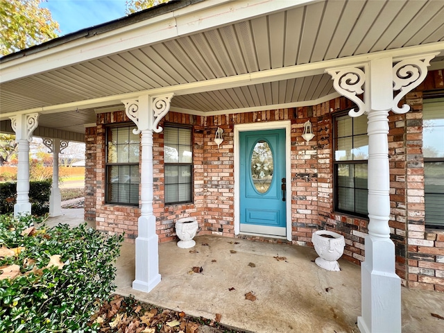 property entrance featuring covered porch