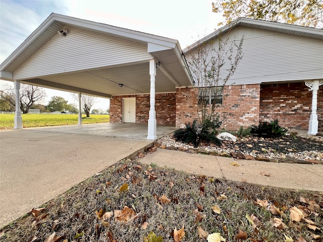 exterior space with a carport