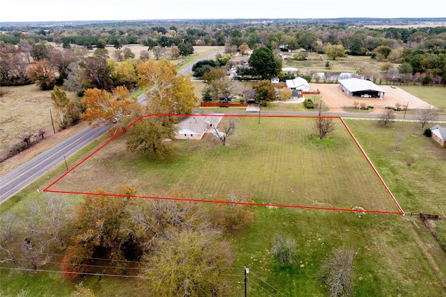 birds eye view of property featuring a rural view