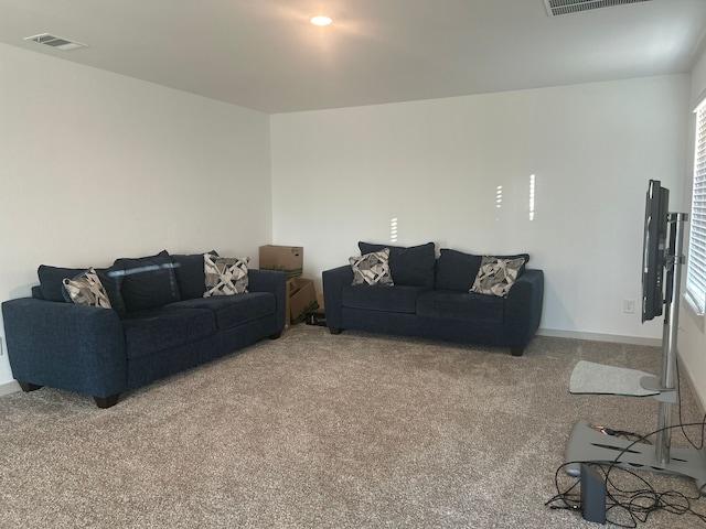 carpeted living room featuring plenty of natural light