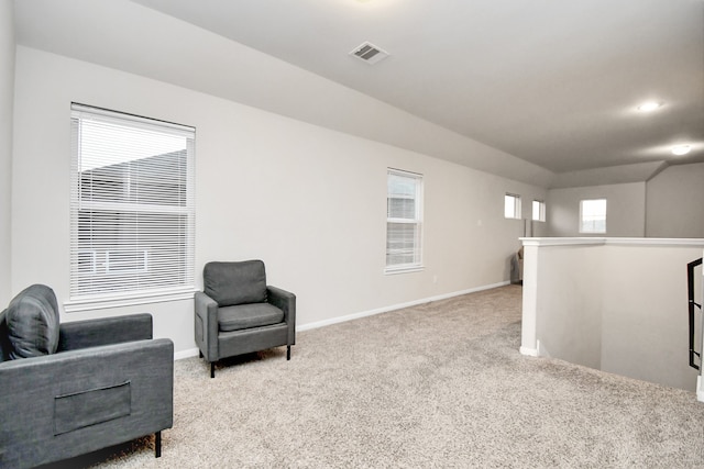 sitting room with light carpet and a wealth of natural light