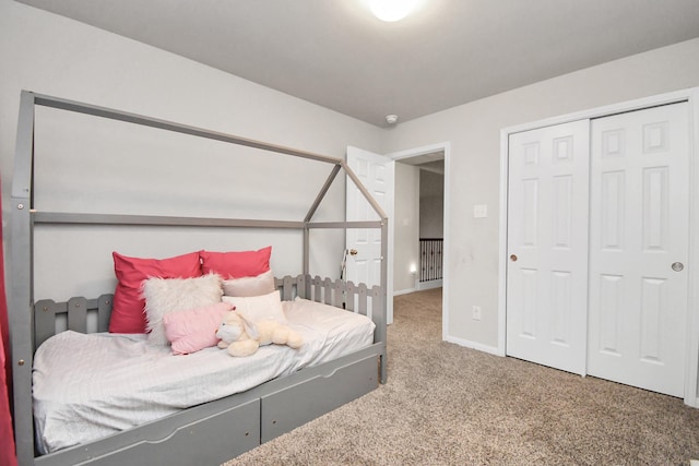 bedroom with carpet floors and a closet