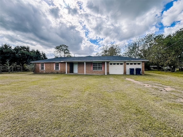 ranch-style home featuring a front lawn and a garage