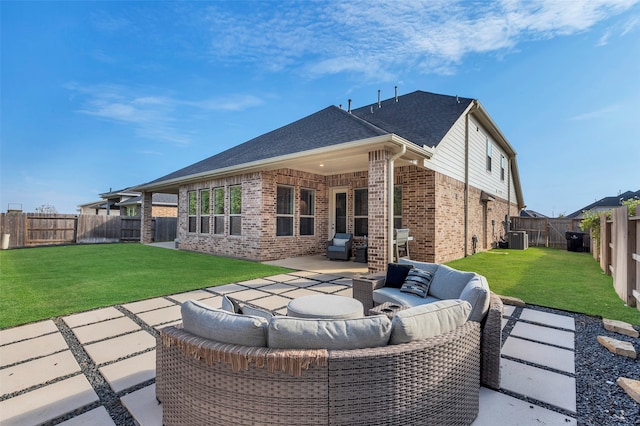 back of house with a patio, central AC unit, and a lawn