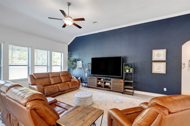 living room featuring crown molding, light hardwood / wood-style flooring, ceiling fan, and lofted ceiling