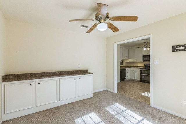 interior space featuring light colored carpet