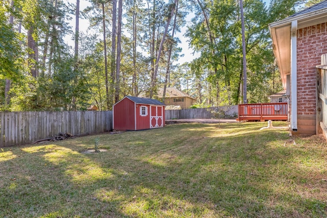 view of yard featuring a shed and a deck