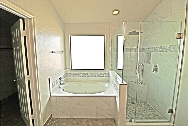 bathroom featuring plus walk in shower and tile patterned floors