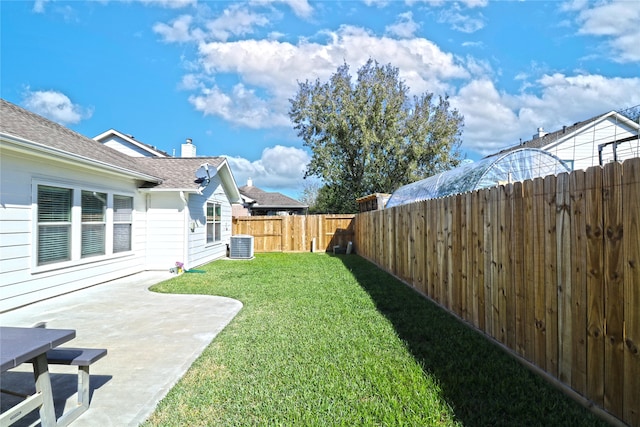 view of yard featuring a patio area and central air condition unit