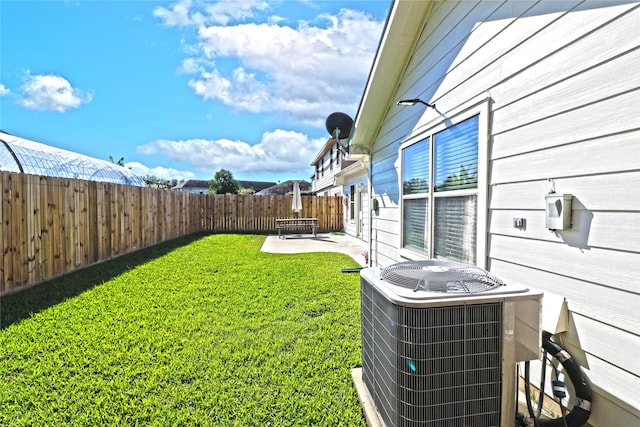 view of yard featuring a patio and central AC unit