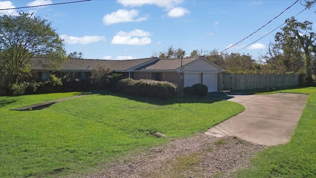 ranch-style house featuring a front yard and a garage