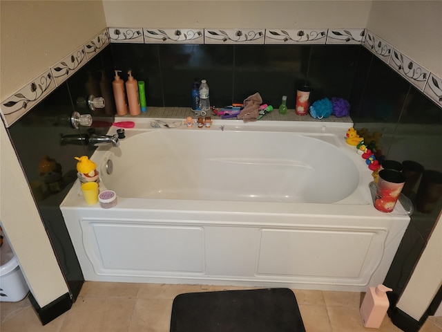 bathroom with tile patterned floors and a bathtub