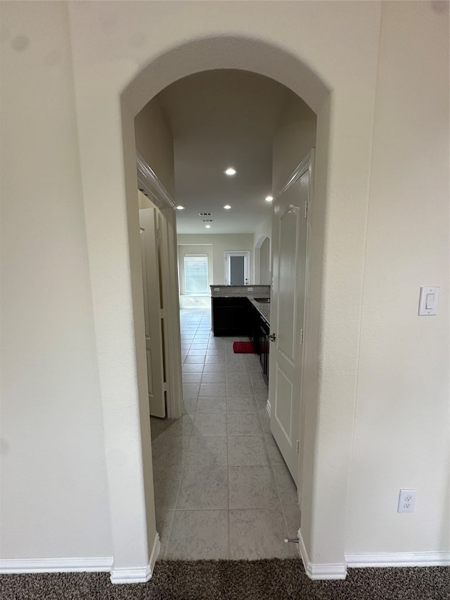 corridor featuring tile patterned floors