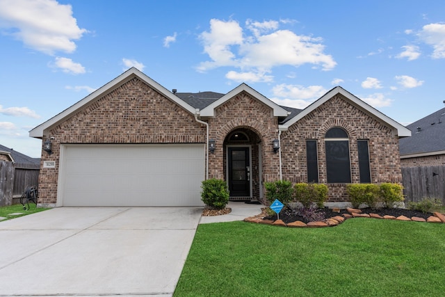 view of front of house with a front lawn and a garage