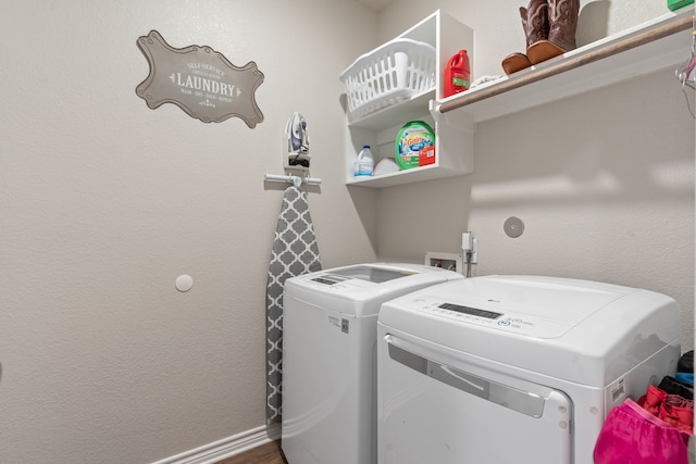 clothes washing area with washer and dryer