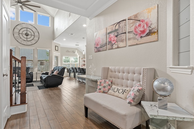 interior space with crown molding and ceiling fan