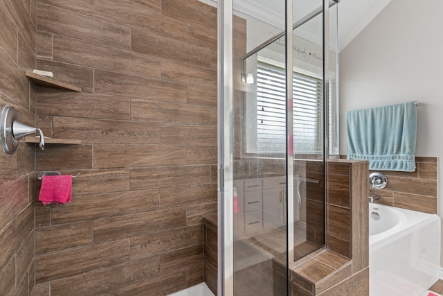 bathroom featuring independent shower and bath and ornamental molding