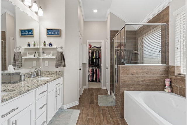 bathroom featuring vanity, crown molding, and plus walk in shower