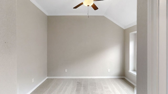 unfurnished room featuring ceiling fan, light colored carpet, lofted ceiling, and ornamental molding