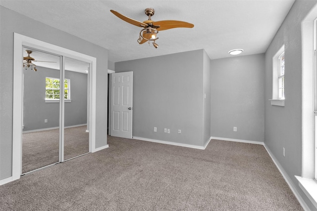 509 Spruce Dr, Conroe, TX 77302 - unfurnished bedroom with carpet floors, baseboards, and a ceiling fan