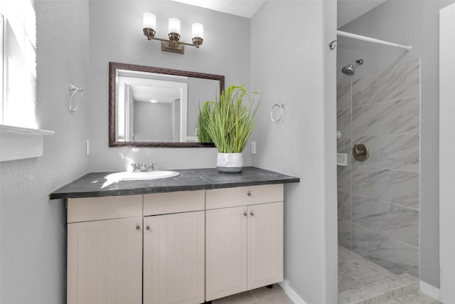 509 Spruce Dr, Conroe, TX 77302 - bathroom with a tile shower and vanity
