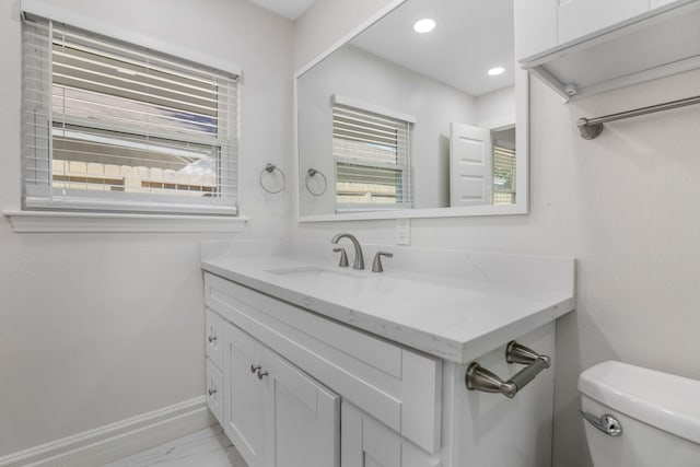 bathroom with vanity and toilet