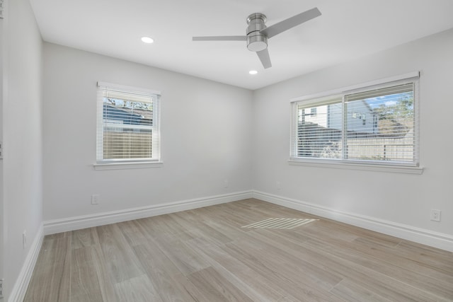 unfurnished room with ceiling fan and light hardwood / wood-style flooring