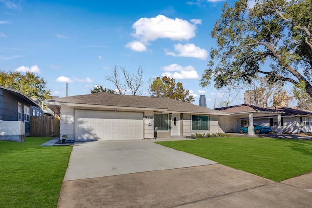 ranch-style home with a front lawn and a garage