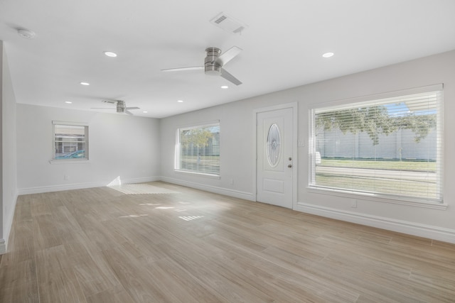 foyer entrance featuring ceiling fan and light hardwood / wood-style floors