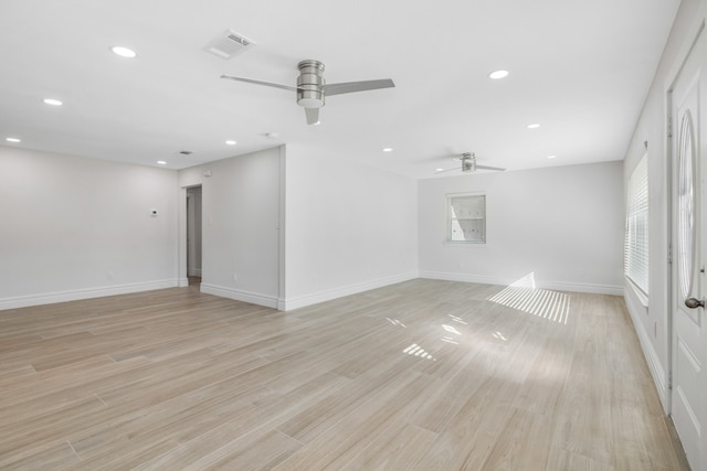 empty room with light hardwood / wood-style flooring and ceiling fan