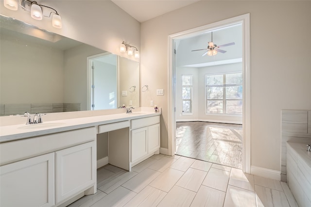 bathroom with ceiling fan and vanity