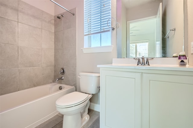 full bathroom with vanity, toilet, and tiled shower / bath