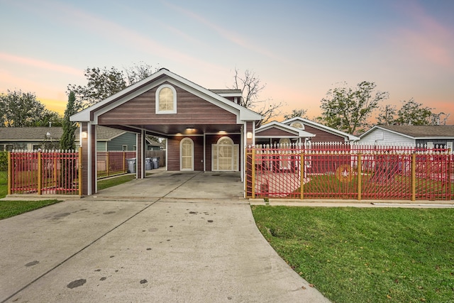 view of front of house with a lawn and a carport