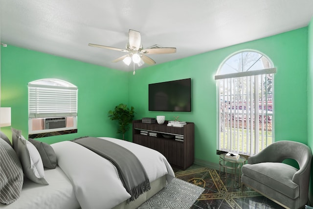 bedroom with ceiling fan and cooling unit